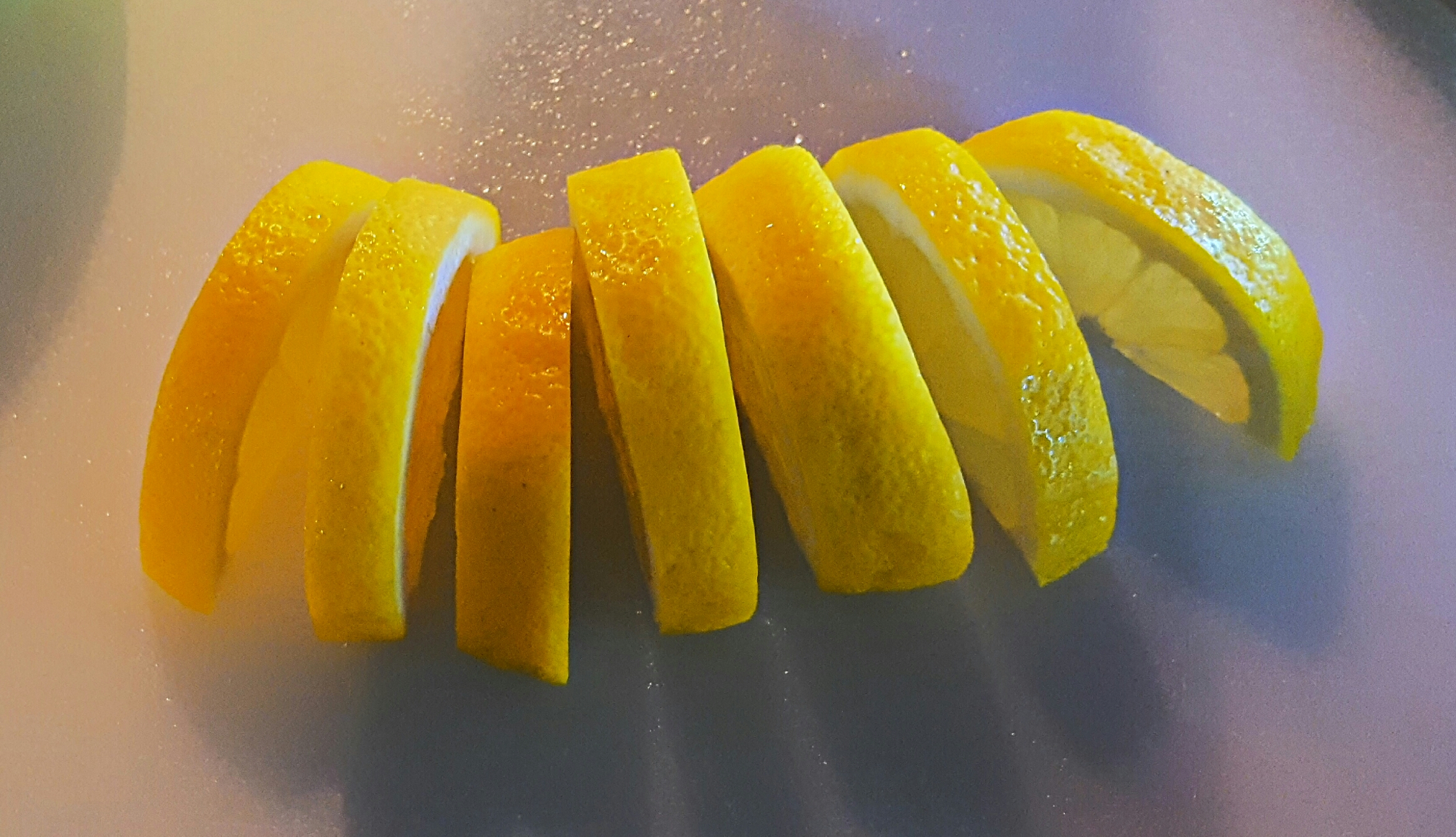 Thin sliced decorative lemon, inappropriate for squeezing.
