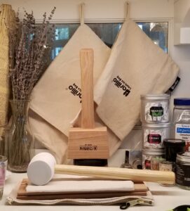 Classic drink's classic tools to make crushed ice. Lewis Bags, a white rubber mallet (Lowe's), and a Wood Mall (Czech Republic), and a folded old fashioned bank coin bag underneath the wood mall - the original Lewis bag!