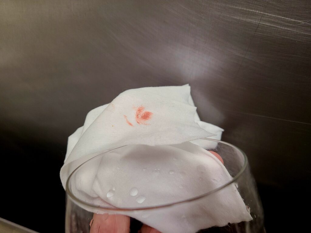Sani-wipe wirh lipstick residue taken from washed martini glass