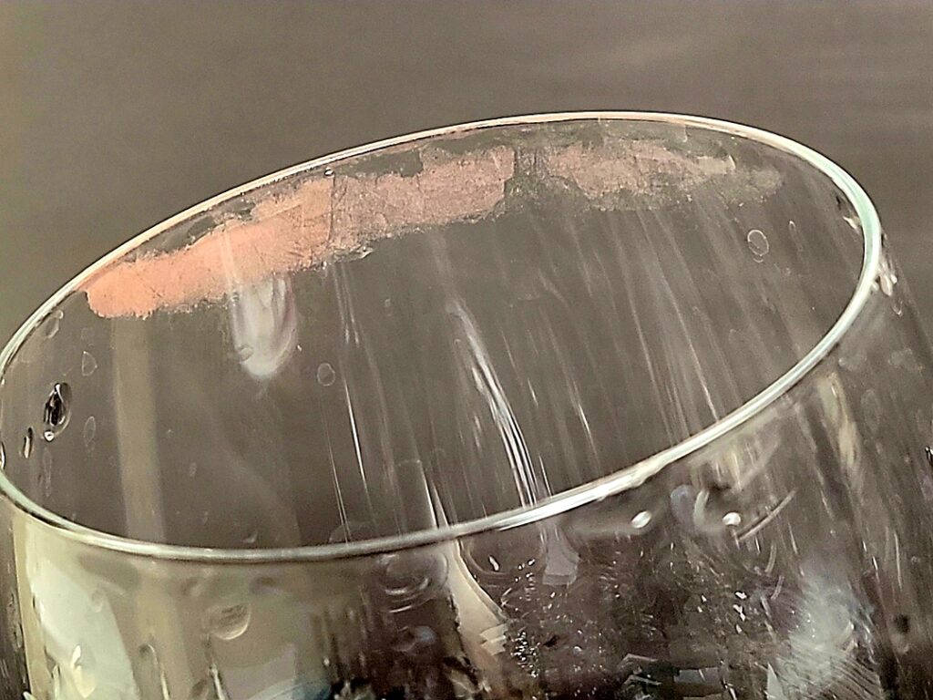 Server washed glass returned to bar and placed by barback 
