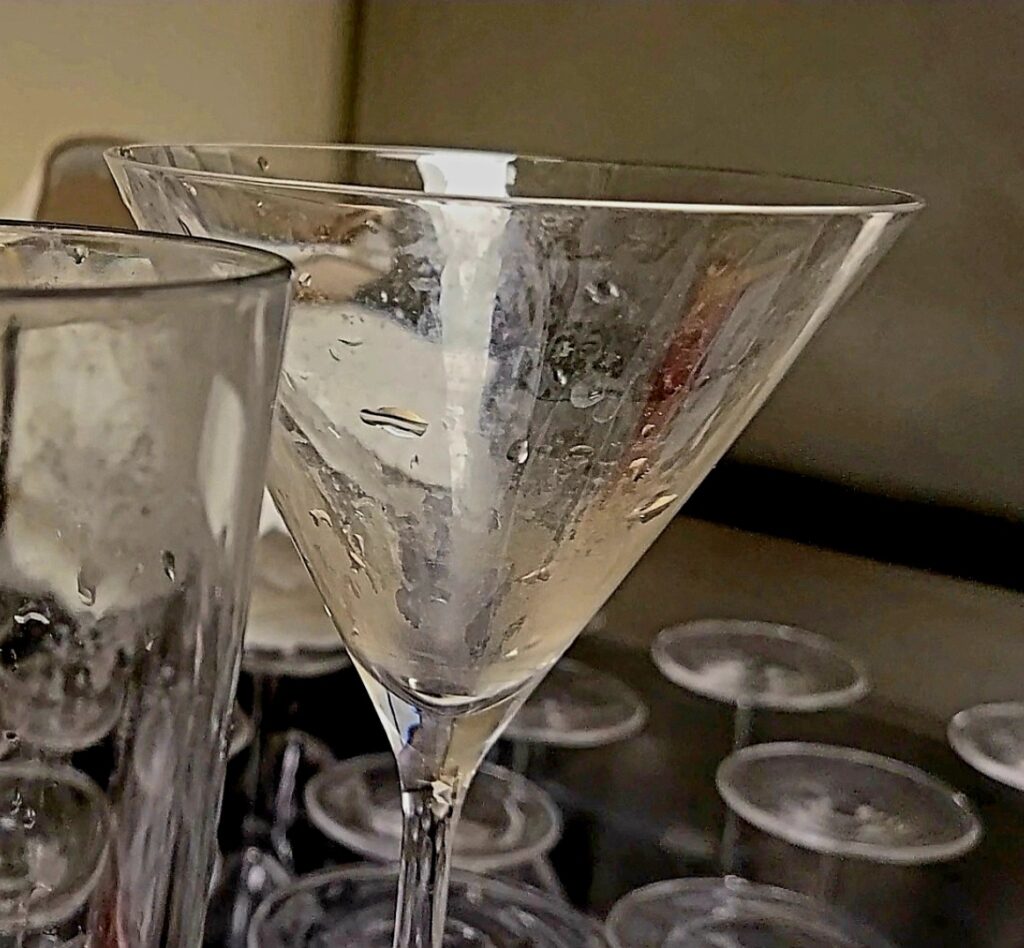 IN SPITE OF A PRE-WASH SINK: FILTH adhering to inside of glassware run through glass washing machine. Result? Filth IN, Filth OUT. (Run through machine by non-visually impaired young, healthy servers)